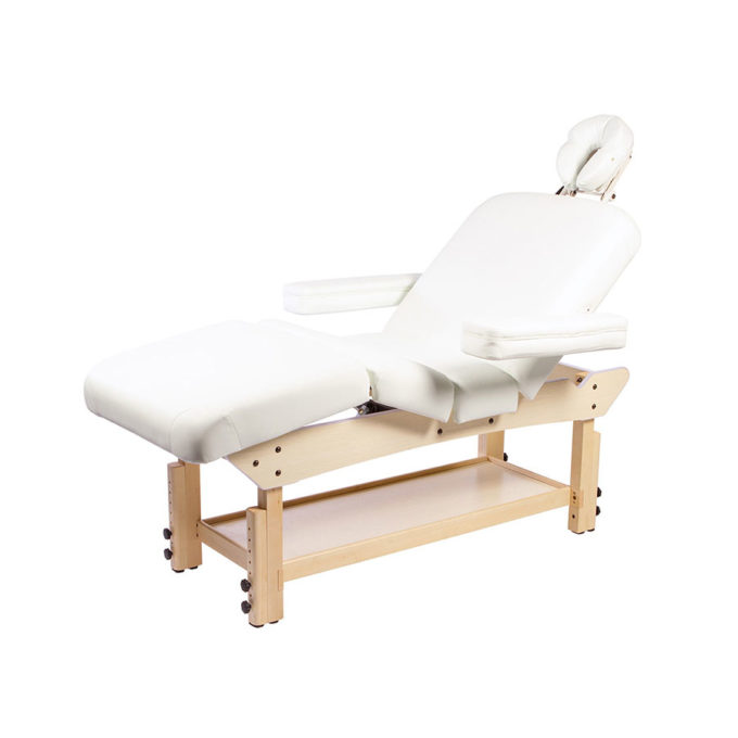 Lit de massage en bois clair avec accoudoir et repose jambes réglables