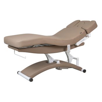 Table de massage spa électrique TAL BEIGE avec matelas chauffant épais de 12 cm en PU beige, trois moteurs pour réglage de la hauteur et des positions, accoudoirs ajustables, appui-tête avec ouverture faciale, base ergonomique incurvée avec roulettes, destinée aux spas et instituts de bien-être professionnels.