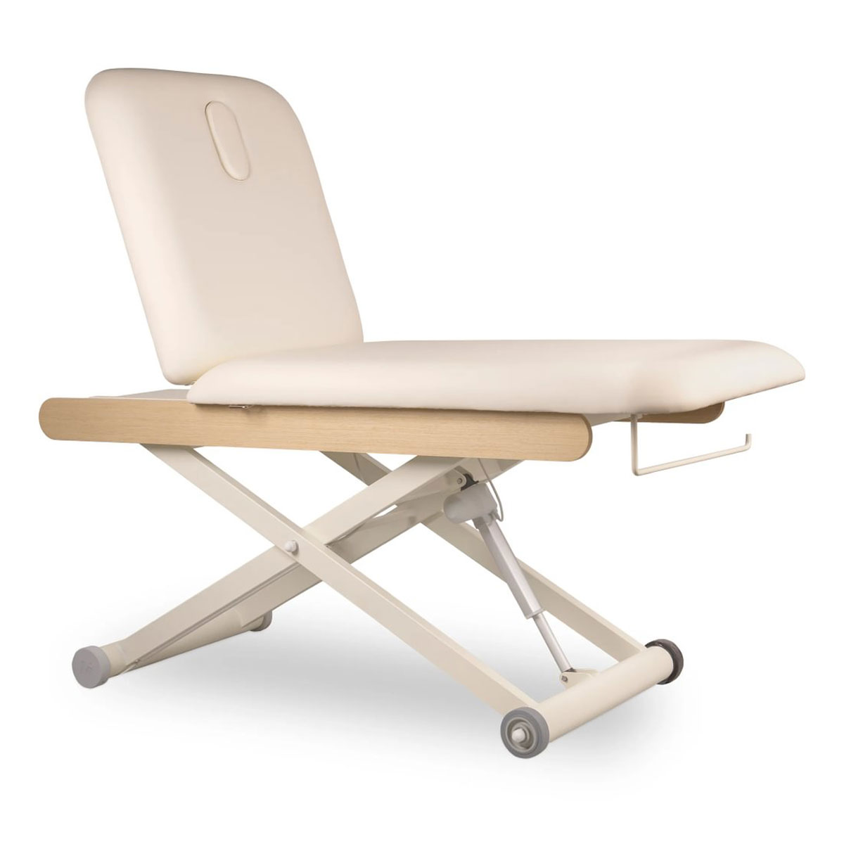 Table de massage électrique DRACO CR OAK avec structure finition bois chêne, hauteur réglable, dossier inclinable, coussin épais en PVC, repose-tête amovible avec cavité faciale et roulettes intégrées.