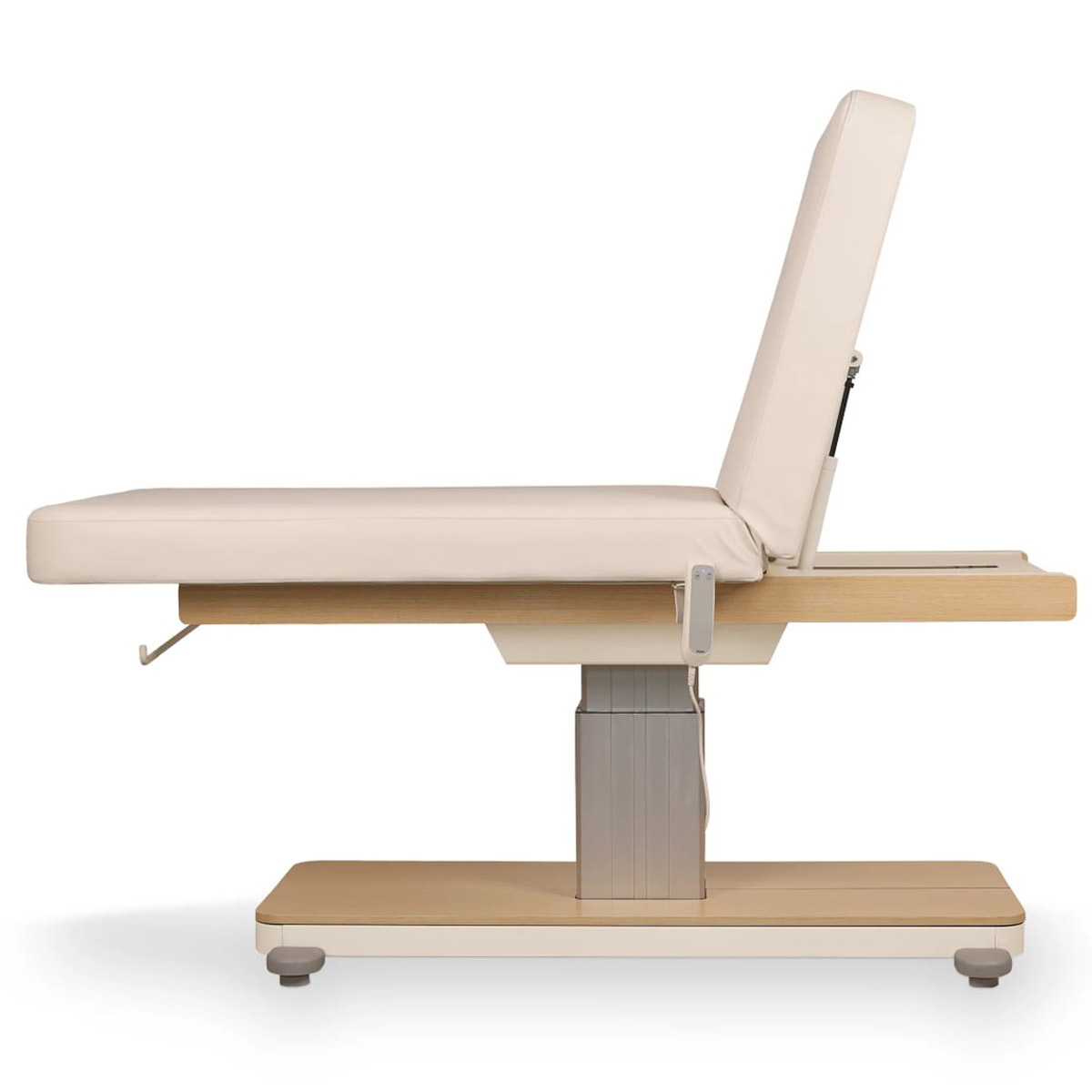 Table de massage ORION CR OAK avec base centrale robuste finition bois, revêtement PU crème, réglage électrique, dossier inclinable, coussin amovible avec ouverture faciale et porte-rouleau intégré.